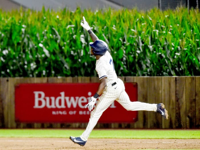 Aug 12, 2021; Dyersville, Iowa, USA; Chicago White Sox shortstop Tim Anderson (7) reacts after hitting a two-run home run in the ninth inning to defeat the New York Yankees at Field of Dreams.
